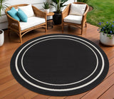 8' Black And Ivory Round Indoor Outdoor Area Rug