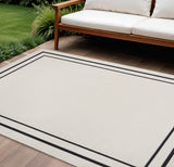 8' X 10' Ivory And Black Indoor Outdoor Area Rug