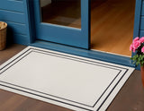 2' X 4' Ivory And Black Indoor Outdoor Area Rug