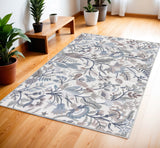 4' X 6' Ivory and Blue Floral Power Loom Washable Non Skid Area Rug