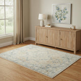4' X 6' Beige and Blue Floral Medallion Power Loom Distressed Washable Area Rug
