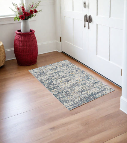 2' X 3' Blue and Ivory Abstract Area Rug