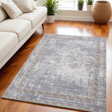 5' X 7' Beige Ivory and Gray Power Loom Area Rug