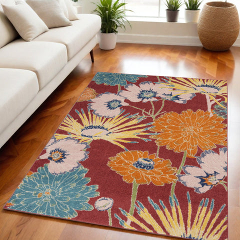 5' X 7' Orange and Red Floral Power Loom Area Rug
