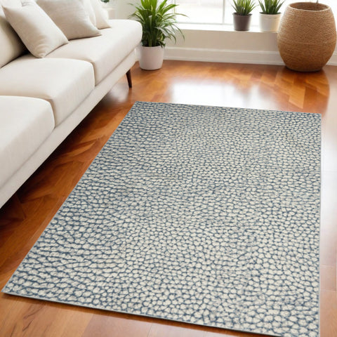 5' X 7' Ivory Blue and Gray Animal Print Power Loom Area Rug