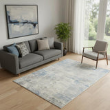 5' X 7' Ivory Blue And Gray Abstract Distressed Area Rug