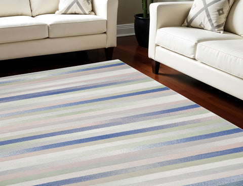 7' X 10' Ivory Tan and Blue Abstract Distressed Non Skid Area Rug