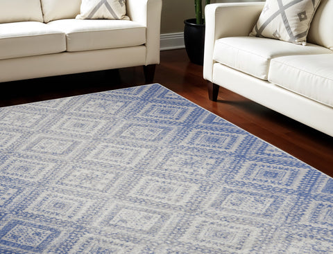 7' X 10' Ivory and Blue Geometric Distressed Non Skid Area Rug