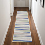 8' Ivory Tan and Blue Abstract Distressed Non Skid Runner Rug