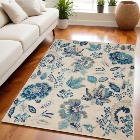 5' X 7' Ivory Navy Blue And Light Blue Floral Area Rug