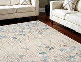 6' X 9' Ivory And Blue Floral Area Rug