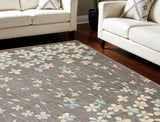 6' X 9' Beige And Gray Floral Area Rug