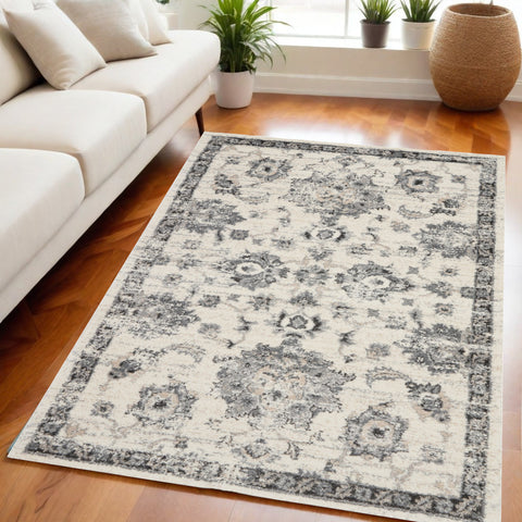 5' X 7' Cream and Gray Floral Distressed Area Rug