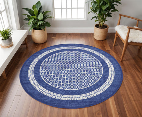 8' Ivory and Navy Blue Geometric Distressed Round Rug
