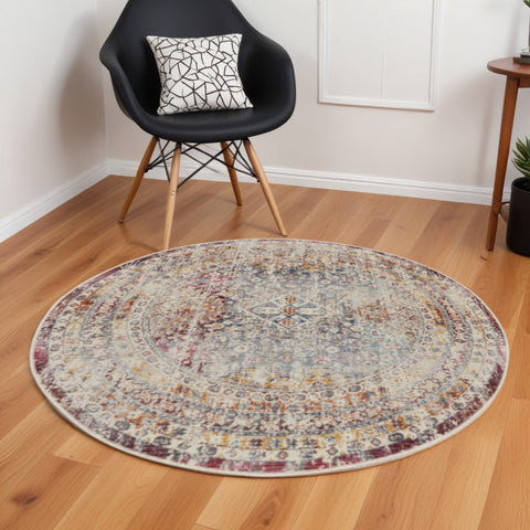 6' Ivory Red And Orange Geometric Distressed Round Rug