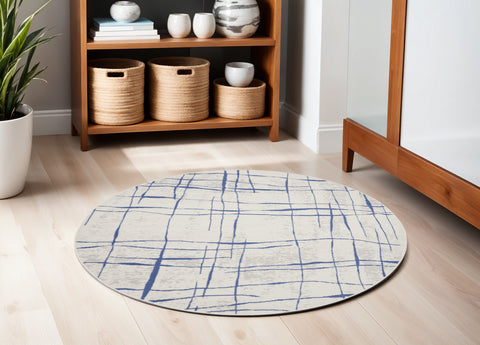 5' Ivory and Blue Abstract Geometric Distressed Round Rug