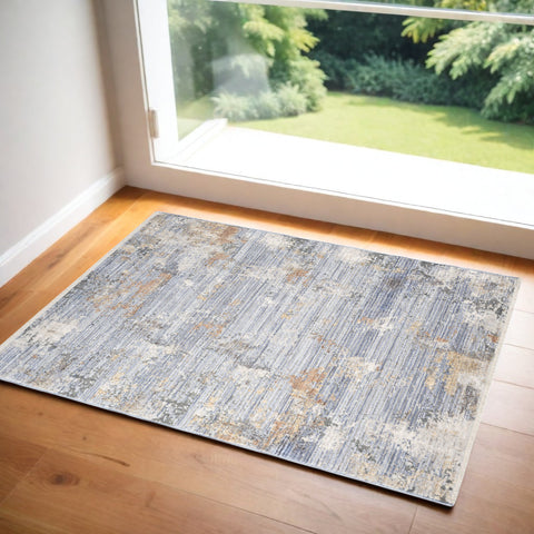 3' X 5' Beige Blue and Gray Abstract Area Rug With Fringe