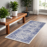 6' Ivory and Navy Blue Geometric Distressed Runner Rug