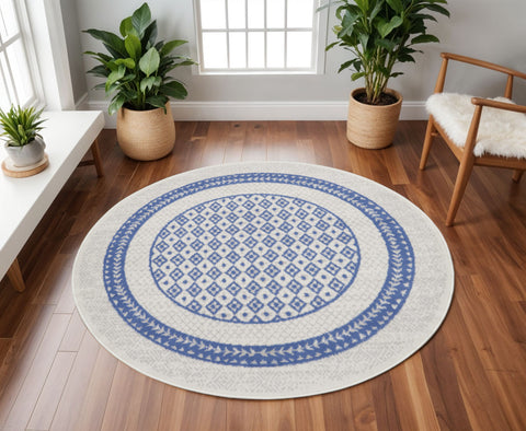 8' Ivory and Blue Geometric Distressed Round Rug