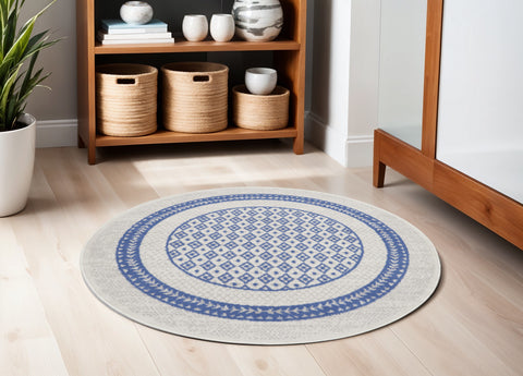 5' Ivory and Blue Geometric Distressed Round Rug