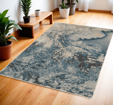 4' X 6' Ivory Teal Blue and Black Abstract Area Rug