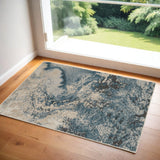 2' X 4' Ivory Teal Blue and Black Abstract Area Rug