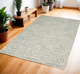 4' X 6' Ivory And Turquoise Wool Geometric Area Rug