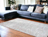 8' X 11' Pink Beige And Off White Abstract Washable Area Rug