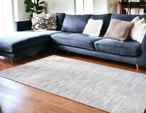 8' X 11' Pink Beige And Off White Abstract Washable Area Rug