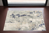 2' X 3' Blue and Beige Abstract Area Rug