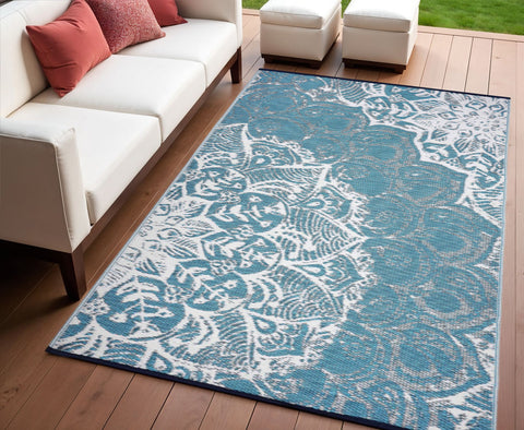 4' X 6' Teal Blue Floral Machine Braided Distressed Area Rug With UV Protection