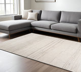 7' X 10' Cream and Beige Abstract Area Rug