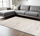 7' X 10' Cream and Beige Abstract Area Rug