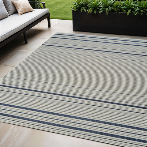 5' X 7' Blue and Cream Striped Distressed Indoor Outdoor Area Rug