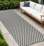 10' Black and White Geometric Distressed Indoor Outdoor Runner Rug