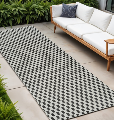 10' Black and White Geometric Distressed Indoor Outdoor Runner Rug
