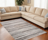 5' X 8' Beige and Gray Abstract Distressed Area Rug