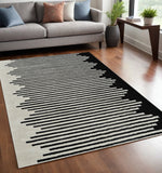 5' X 8' Cream and Black Abstract Worn Faded Area Rug