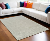 5' X 8' Cream and Green Abstract Worn Faded Area Rug
