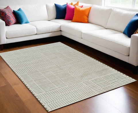 5' X 8' Cream and Green Abstract Worn Faded Area Rug