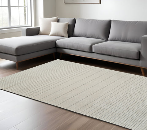 7' X 10' Cream and Beige Abstract Non Skid Area Rug