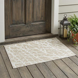 2' X 3' Beige and Ivory Abstract Washable Non Skid Indoor Outdoor Area Rug