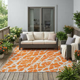 5' X 8' Orange and White Abstract Washable Non Skid Indoor Outdoor Area Rug