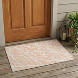 2' X 3' Peach and Ivory Abstract Washable Non Skid Indoor Outdoor Area Rug