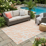 5' X 8' Peach and Ivory Abstract Washable Non Skid Indoor Outdoor Area Rug