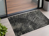 2' X 3' Black and Ivory Abstract Washable Non Skid Indoor Outdoor Area Rug