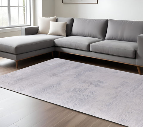 5' X 8' Gray and Ivory Abstract Power Loom Worn Faded Area Rug