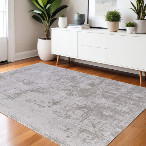 5' X 8' Taupe and Ivory Abstract Power Loom Worn Faded Area Rug