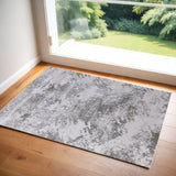 2' X 3' Tan and Ivory Abstract Power Loom Worn Faded Area Rug