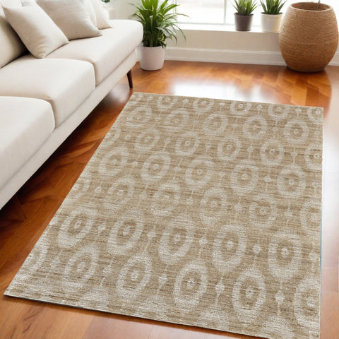 5' X 8' Tan and Ivory Geometric Hand Woven Area Rug